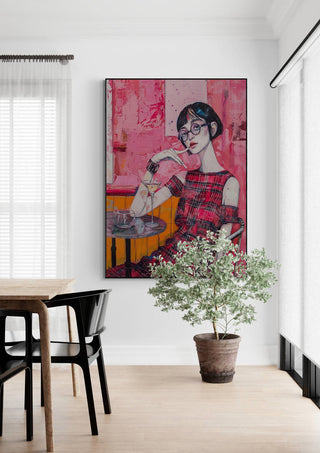 Wicked Game by Tara Green artwork hanging on a white wall above a potted plant in a modern dining room.