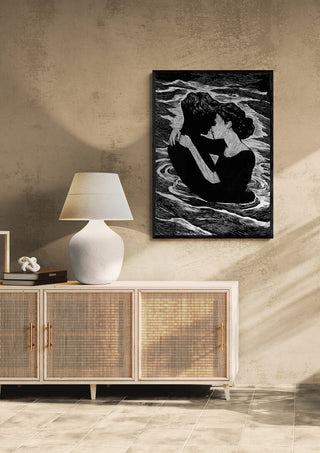Framed Silhuet Lovers by Martin Zen displayed above a modern sideboard in a minimalist living room.