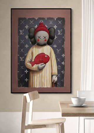 Framed Kaws n Fish artwork by Danii Steinfeldt featuring a figure holding a red fish, displayed on a wall.
