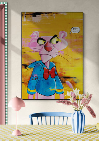 Colorful Pink Duck artwork by Daniel Leo featuring a cartoon figure in blue, displayed above a dining table.