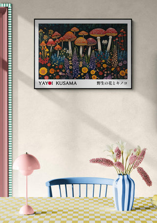 Framed Yayoi Kusama "Infinity" mushroom artwork displayed above a dining table with pink lamp and flowers.