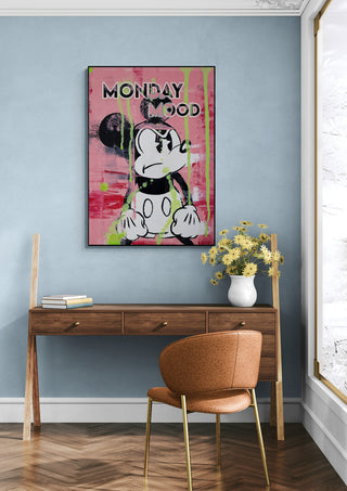 Monday Mood - Daniel Leo art print featuring a cartoon character on a pink background, displayed above a desk.