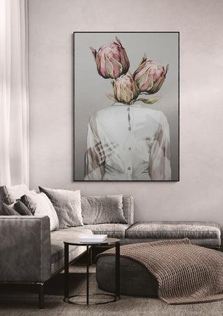 Framed artwork “Unknown Longing No.I” by Gabriella Roberg displayed above a modern grey sofa in a living room.