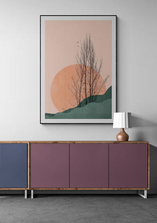 Sunset Memories by Boris Draschoff artwork with minimalist tree and sun above a modern sideboard and lamp.