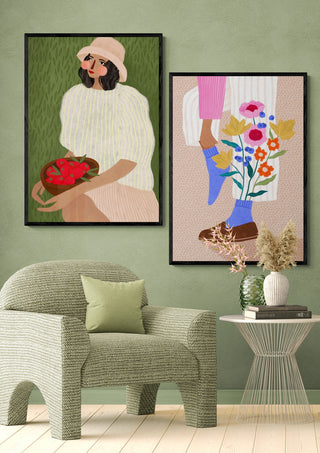 Framed Blooming Socks - Bea Muller artwork displayed above a green armchair in a modern living room setting.