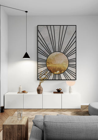 Black gold mid sun by Sarah Manovski displayed above a white console in a modern living room.