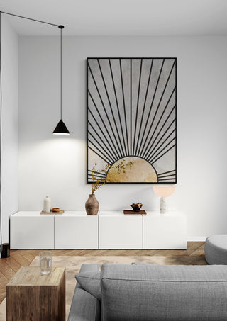Black gold rising sun artwork by Sarah Manovski displayed in a modern living room above a white cabinet.