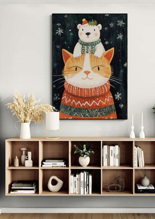 Festive cat in a sweater with a bear on its head, Cozy Cat Christmas wall art displayed above shelf.