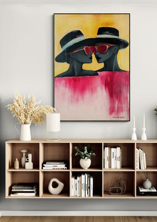 Framed "Two" by David Wolf featuring two figures in hats and red sunglasses above a modern sideboard.