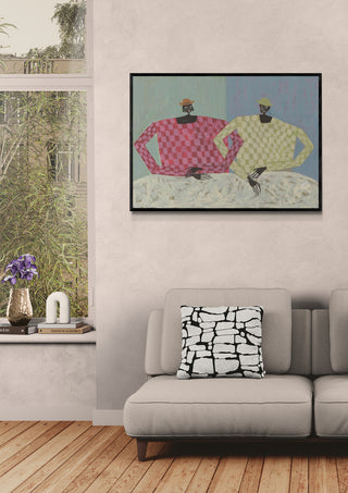 Framed "Opposites" artwork by Studio IMO hanging above a sofa in a modern living room setting.