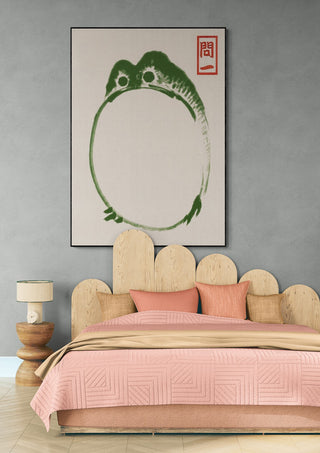Minimalist frog art print "Grumpy Toad III" by Matsumoto Hoji hanging above a bed in a modern bedroom.