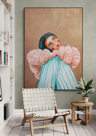Painting "Dreaming girl" by Raissa Oltmanns on a wall in a modern living room with chair and small table.
