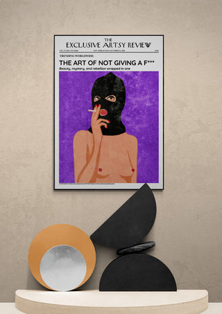 Poster of a topless person in a balaclava smoking, titled "The Art of Not Giving a F***", on a modern shelf.